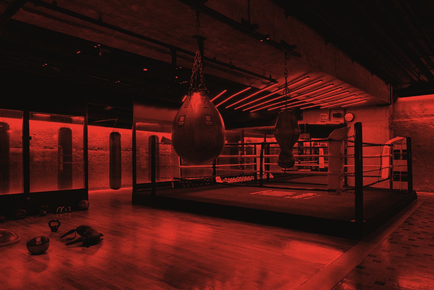 The ring and heavy bags under warehouse lights